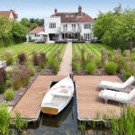 Riverside house garden and mooring. Suffolk Image.